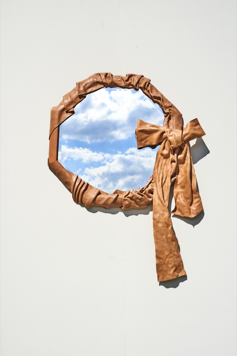 Leather mirror art piece by Bianca Stilwell