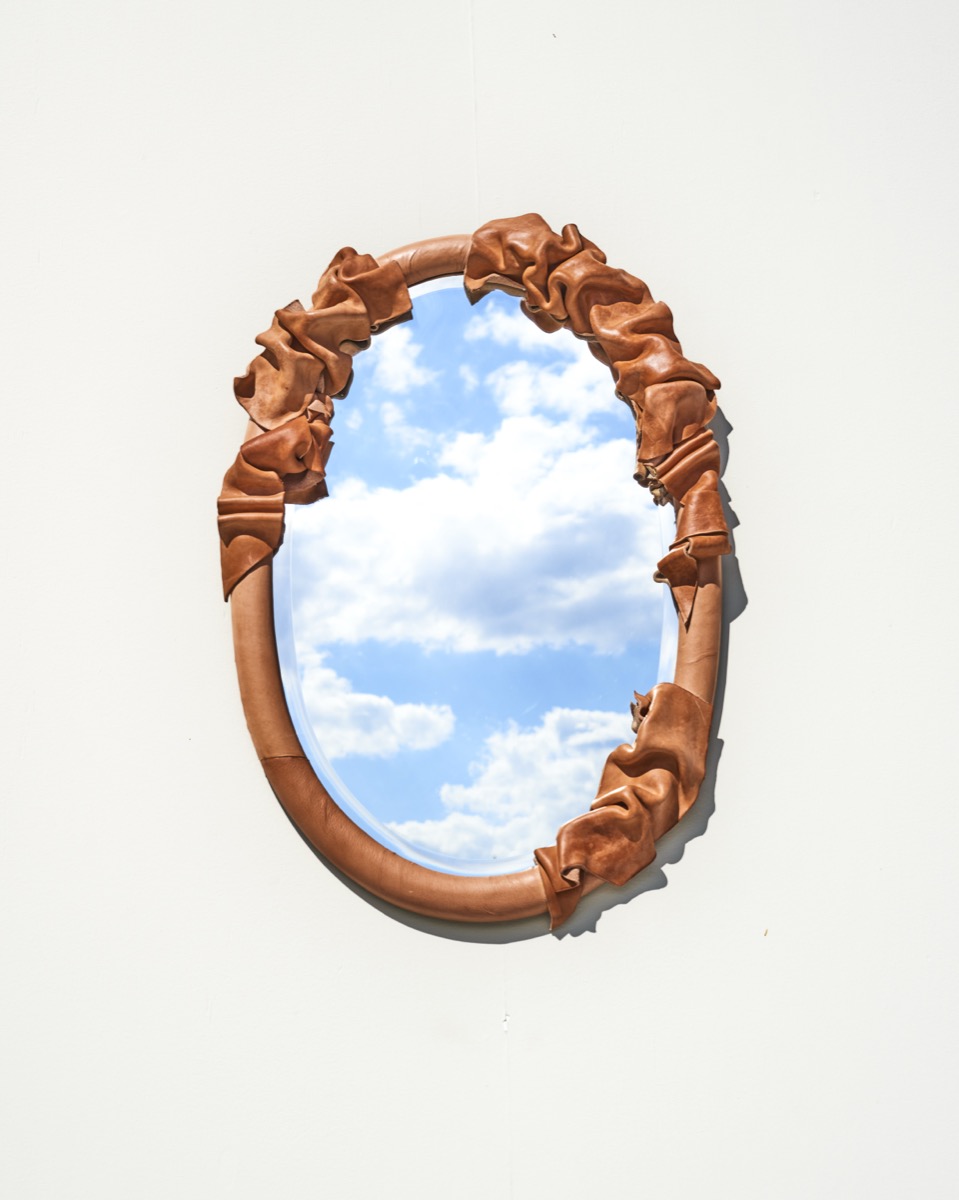 Custom leather mirror with traditional craftsmanship