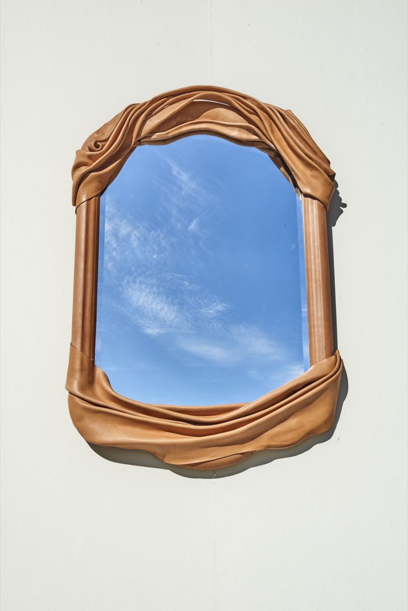 Experimental leather art piece featuring cuir bouilli surface treatment