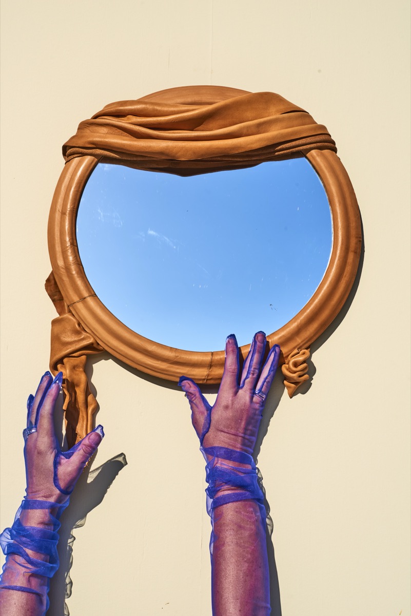 Avant-garde leather mirror with cuir bouilli technique for progressive interior designers