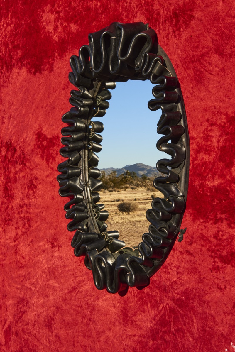 Contemporary leather mirror with historical techniques
