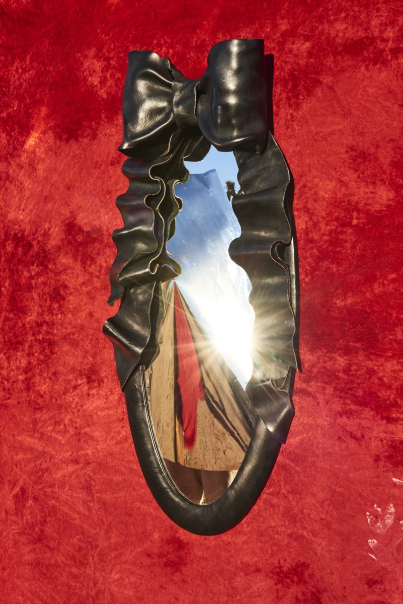 Custom leather mirror showcasing vanitas themes