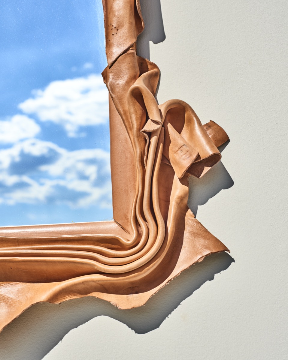 Cutting-edge leather lighting fixture using medieval techniques for contemporary spaces